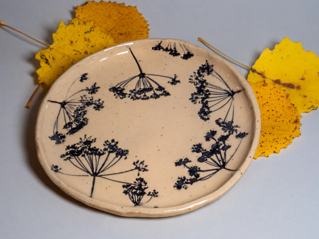 Plates with leaves embossed to the clay. Made by Kaia Klementi