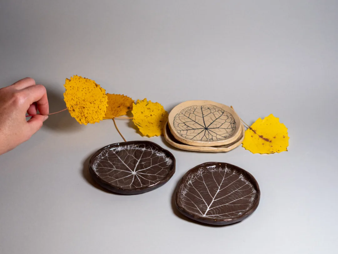 Plates with leaves embossed to the clay. Made by Kaia Klementi