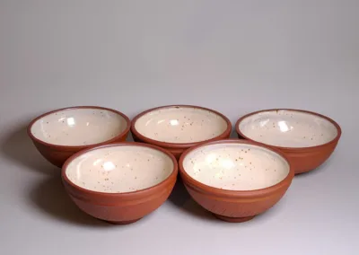 Medium bowls from red stoneware and buff speckled glaze inside