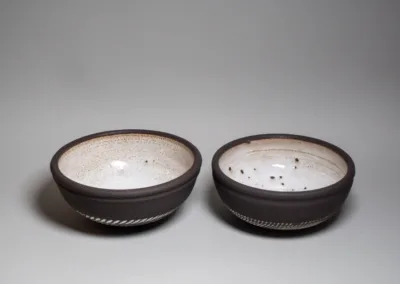 Black stoneware medium bowls with white glaze and white chattered texture