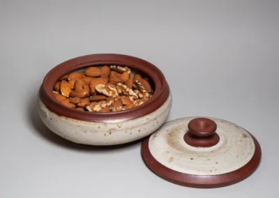 shallow lidded jar from red clay and buff speckled glaze