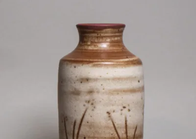 Vase from red stoneware and mat buff glaze and graffito decoration