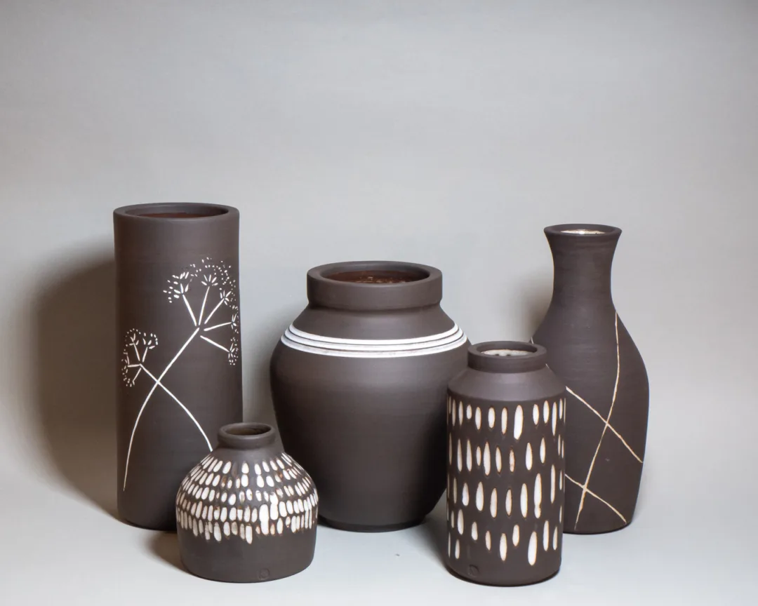 Black stoneware vases with white contrasting decoration