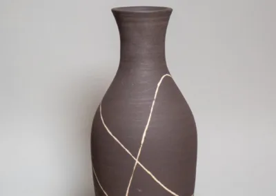 Black stoneware vase with white trails