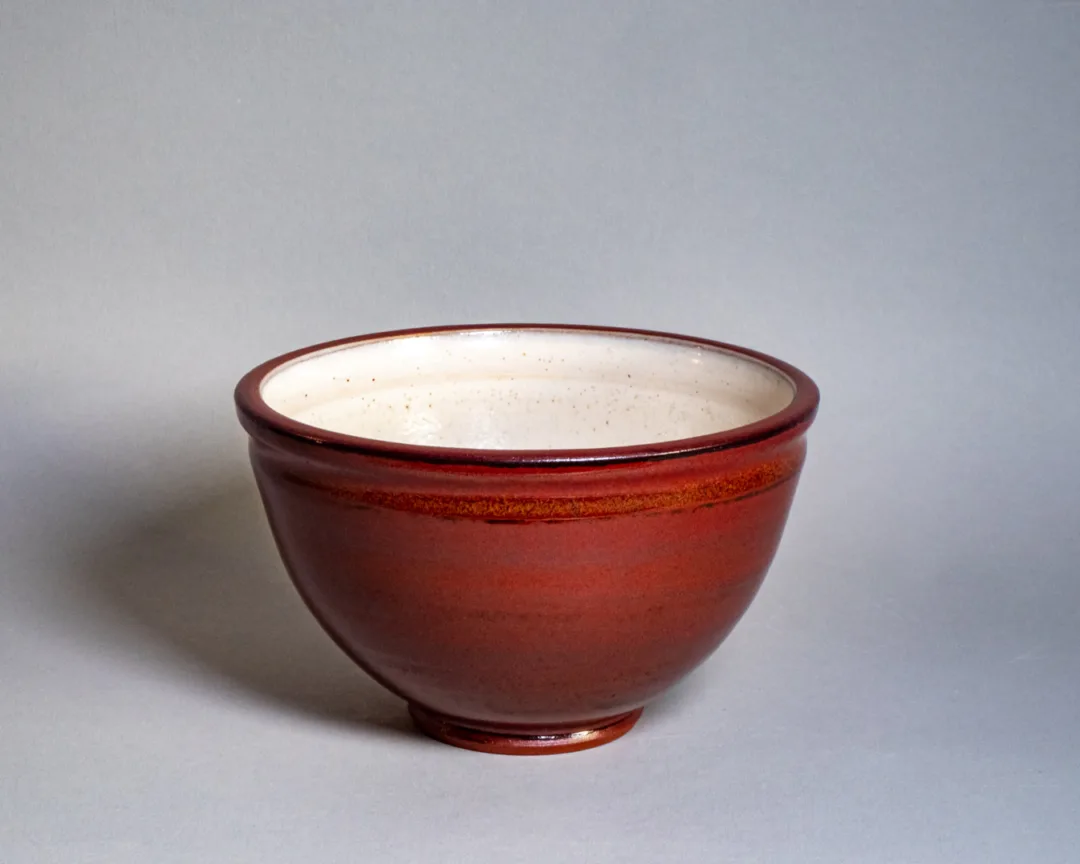 Salad bowl from red stoneware, with rusty red and speckled white glaze