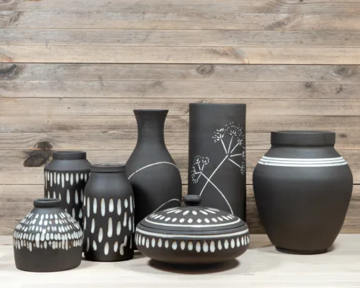 Black stoneware teapot, a tea bowl and storage jar